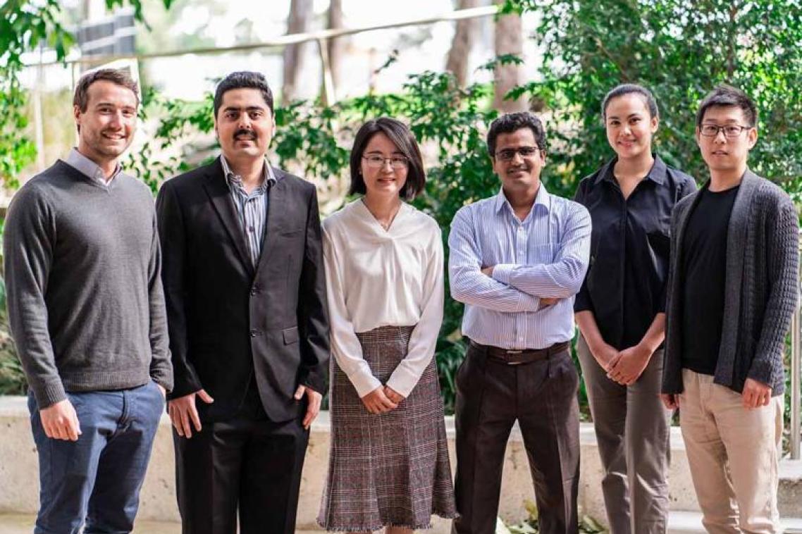 Three Minute Thesis participants standing together.